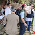 Congress leader Rahul Gandhi gives shoulder to the mortal remains of party leader Captain Satish Sharma  