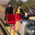 Russian embassy employs travel on railway trolley to reach Russian land