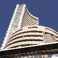 Sensex closes 749 points high