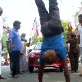 A yoga instructor walked upside down 