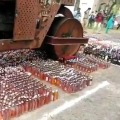 liquor worth seventy two lakhs destroyed with a road roller 