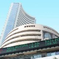 Sensex closes 345 points lower