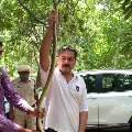 Hyderabad CP Anjani Kumar captures a snake 