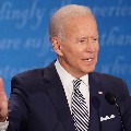 Biden twists ankle while playing with his dog