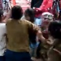 Angry woman grabbed and beaten a girl 