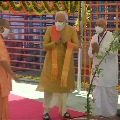 Prime Minister Narendra Modi plants a Parijat sapling