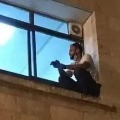 Palestinian climbs wall to see mom through window before she dies of COVID