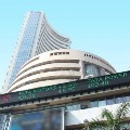 Sensex ends 354 higher