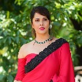 anchor Anasuya looks elegant in her red coloured saree pics