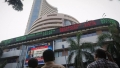 Sensex closes in green