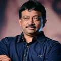 Ram Gopal Varma poses with a Rotweiler dog